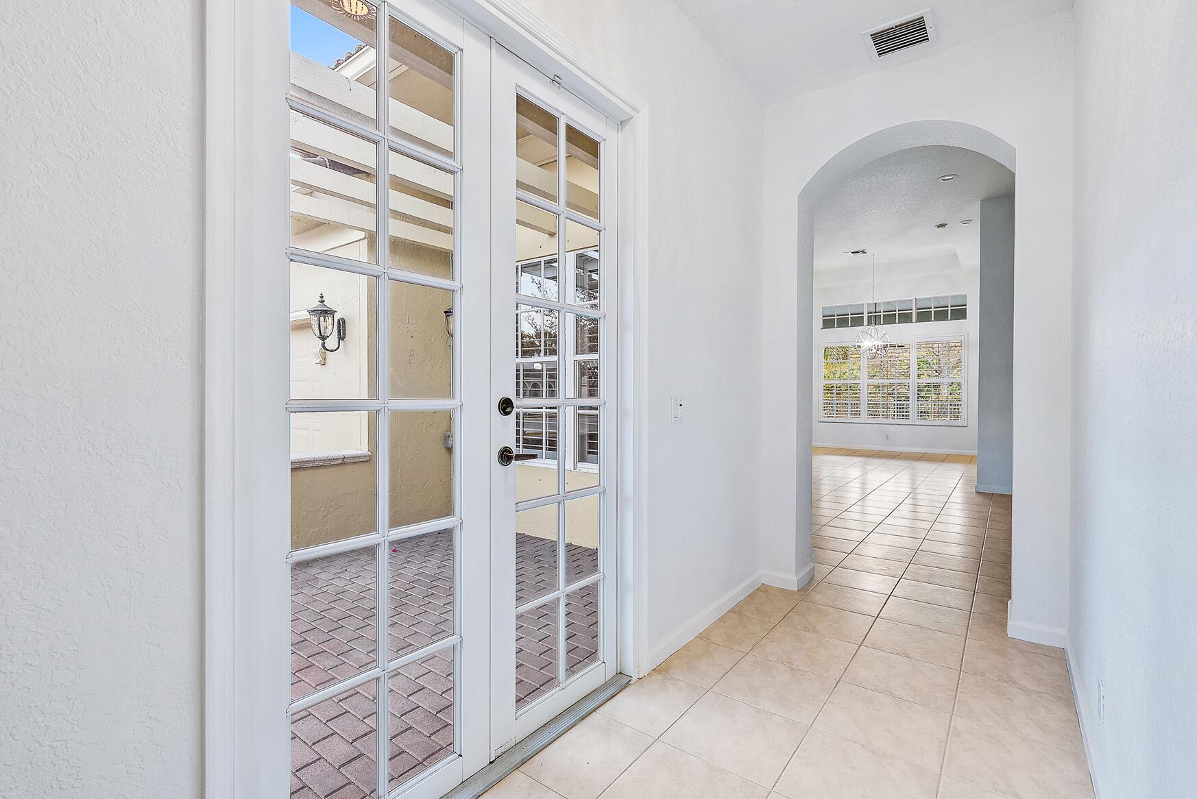 116 Via Rosina Jupiter, FL 33458 - Photo 19 of 33 a view of a hallway with windows