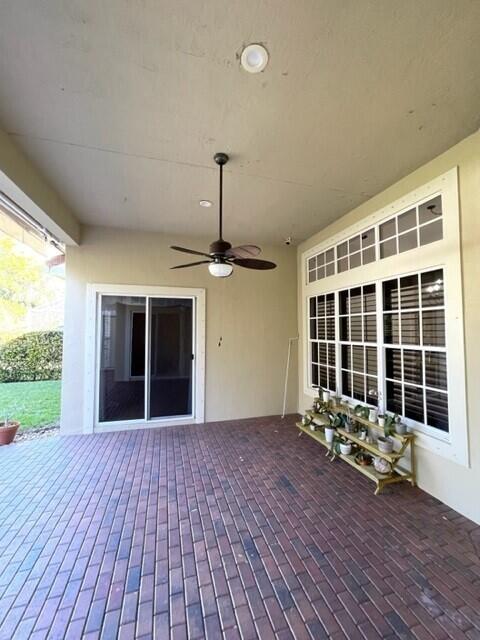 116 Via Rosina Jupiter, FL 33458 - Photo 26 of 33 a view of a house with porch with wooden floor