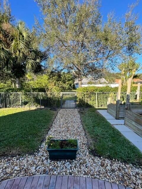 116 Via Rosina Jupiter, FL 33458 - Photo 30 of 33 a view of garden with wooden bridge