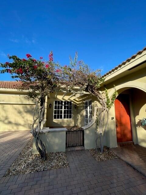 116 Via Rosina Jupiter, FL 33458 - Photo 3 of 33 a view of a house with a yard