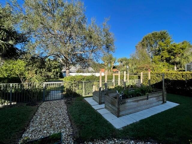 116 Via Rosina Jupiter, FL 33458 - Photo 32 of 33 a garden view with tall trees
