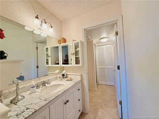 a bathroom with a toilet a sink and shower