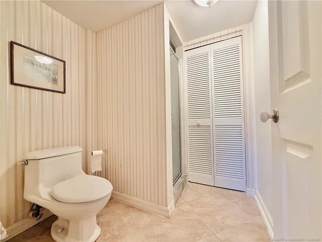 a bathroom with a glass shower door