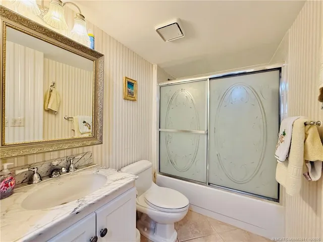 a bathroom with a shower and a toilet