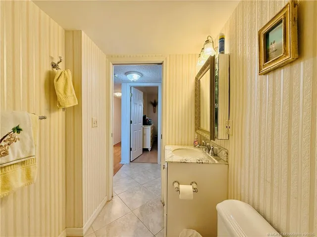 a bedroom with a bed and a chair