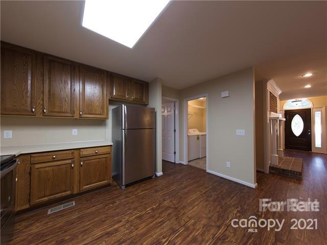 1347 Mistletoe Ridge Place Northwest Concord, NC 28027 - Photo 15 of 34 a view of a kitchen with wooden floor