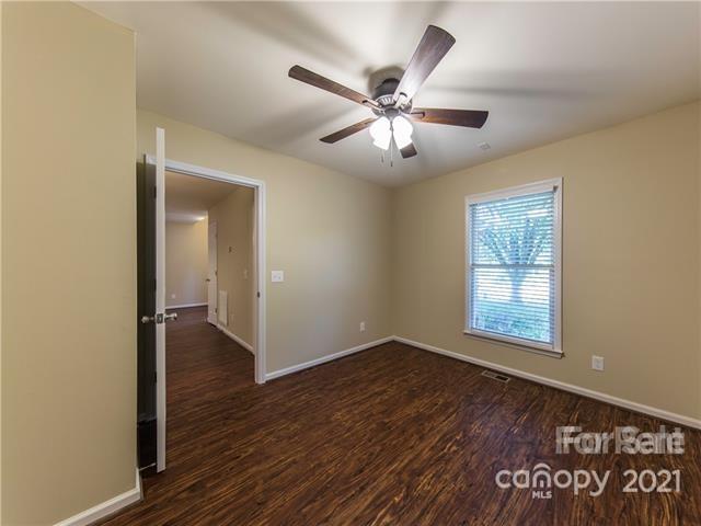 1347 Mistletoe Ridge Place Northwest Concord, NC 28027 - Photo 25 of 34 a view of an empty room with wooden floor and a window
