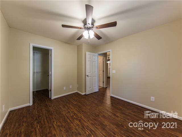 1347 Mistletoe Ridge Place Northwest Concord, NC 28027 - Photo 26 of 34 a view of an empty room with wooden floor
