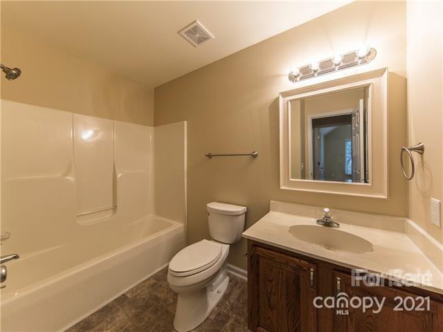 1347 Mistletoe Ridge Place Northwest Concord, NC 28027 - Photo 27 of 34 a bathroom with a sink a toilet and shower