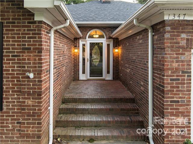 1347 Mistletoe Ridge Place Northwest Concord, NC 28027 - Photo 3 of 34 a view of a patio with table and chairs
