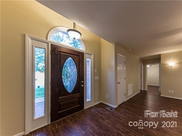 1347 Mistletoe Ridge Place Northwest Concord, NC 28027 - Photo 4 of 34 a view of a hallway with wooden floor