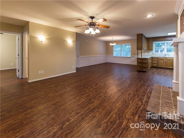 1347 Mistletoe Ridge Place Northwest Concord, NC 28027 - Photo 5 of 34 wooden floor in an empty room with a window