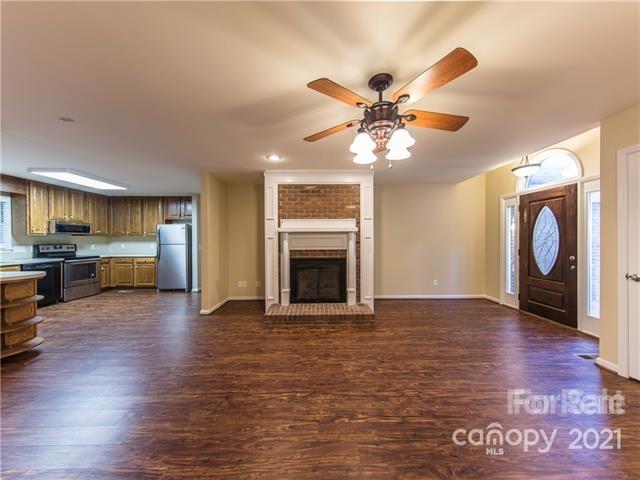 1347 Mistletoe Ridge Place Northwest Concord, NC 28027 - Photo 7 of 34 a view of a kitchen with a stove cabinets and wooden floor