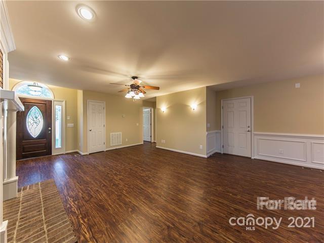 1347 Mistletoe Ridge Place Northwest Concord, NC 28027 - Photo 8 of 34 a view of an empty room with wooden floor