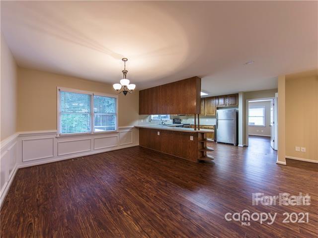 1347 Mistletoe Ridge Place Northwest Concord, NC 28027 - Photo 10 of 34 a view of a kitchen with wooden floor and a kitchen