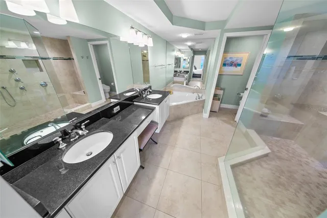 a balcony with wooden floor table and chairs