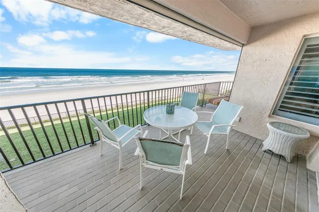 a view of a balcony with wooden floor