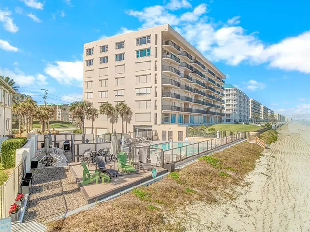 a view of outdoor space with garden and signage
