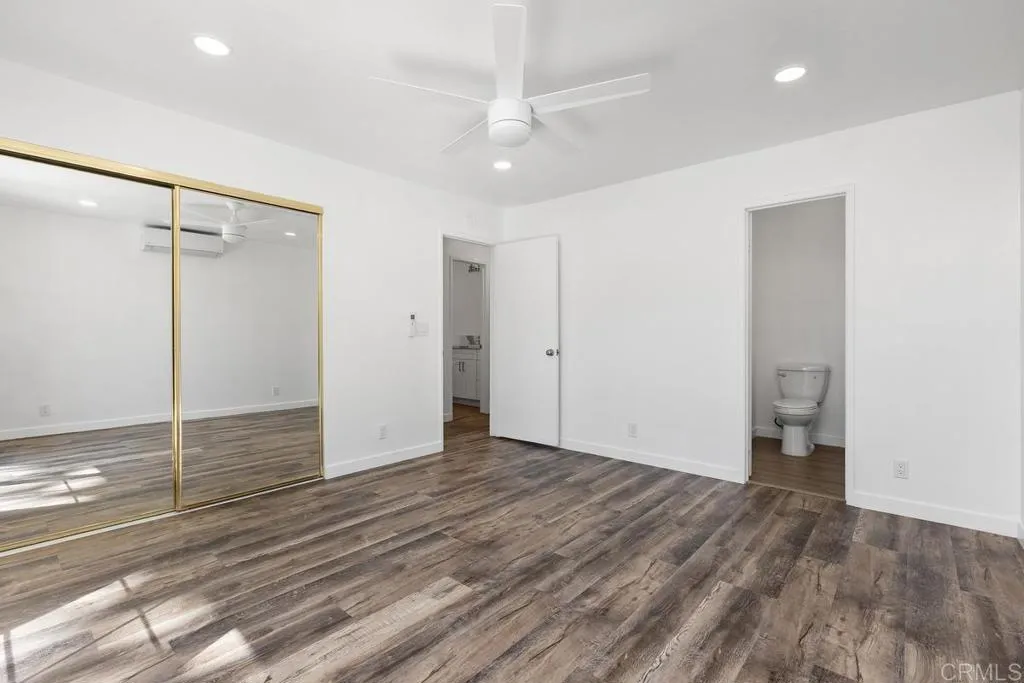 889 Bracero Road Encinitas, CA 92024 - Photo 47 of 59 a view of an empty room with wooden floor