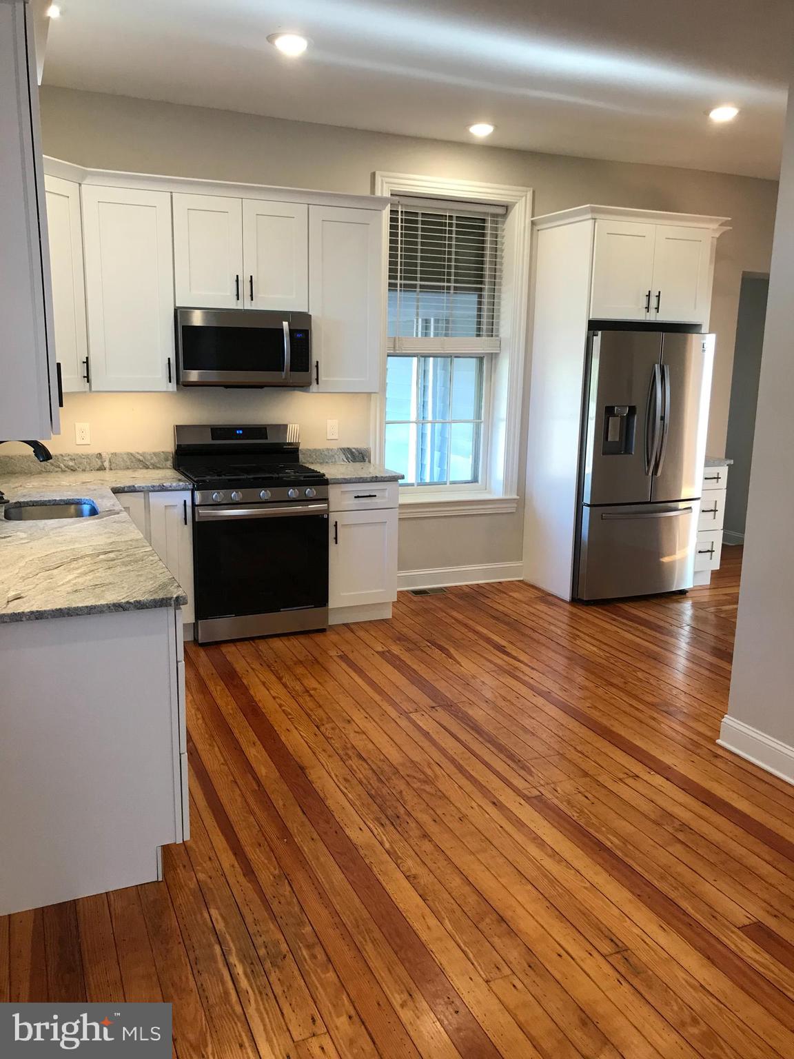 15 A Potter Street Haddonfield, NJ 08033 - Photo 2 of 11 a kitchen with stainless steel appliances a refrigerator sink and microwave