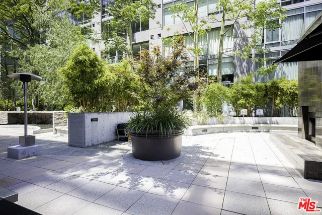 a view of a building with sitting area