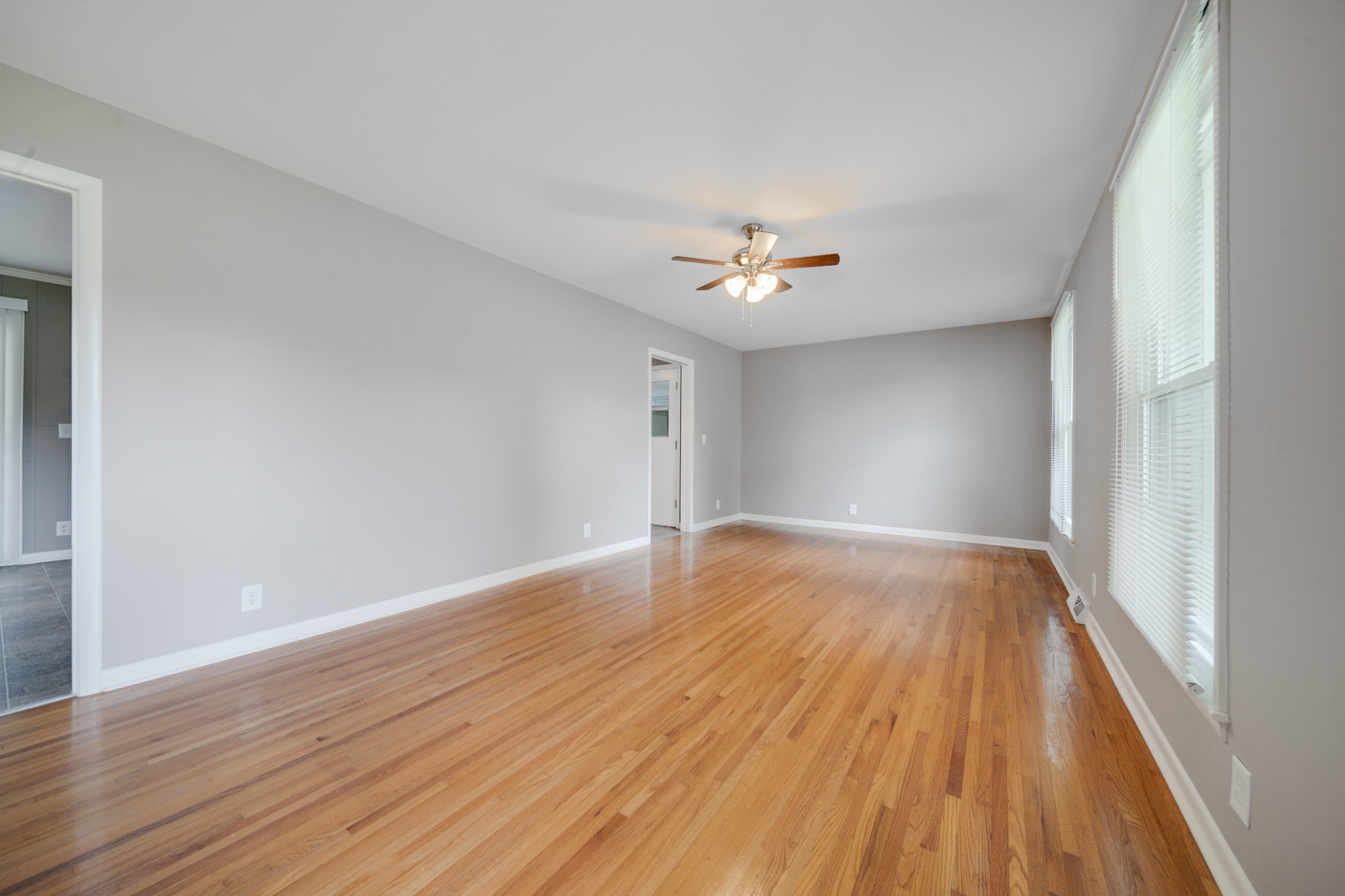 411 Walton Ferry Road Hendersonville, TN 37075 - Photo 11 of 26 a view of an empty room with wooden floor