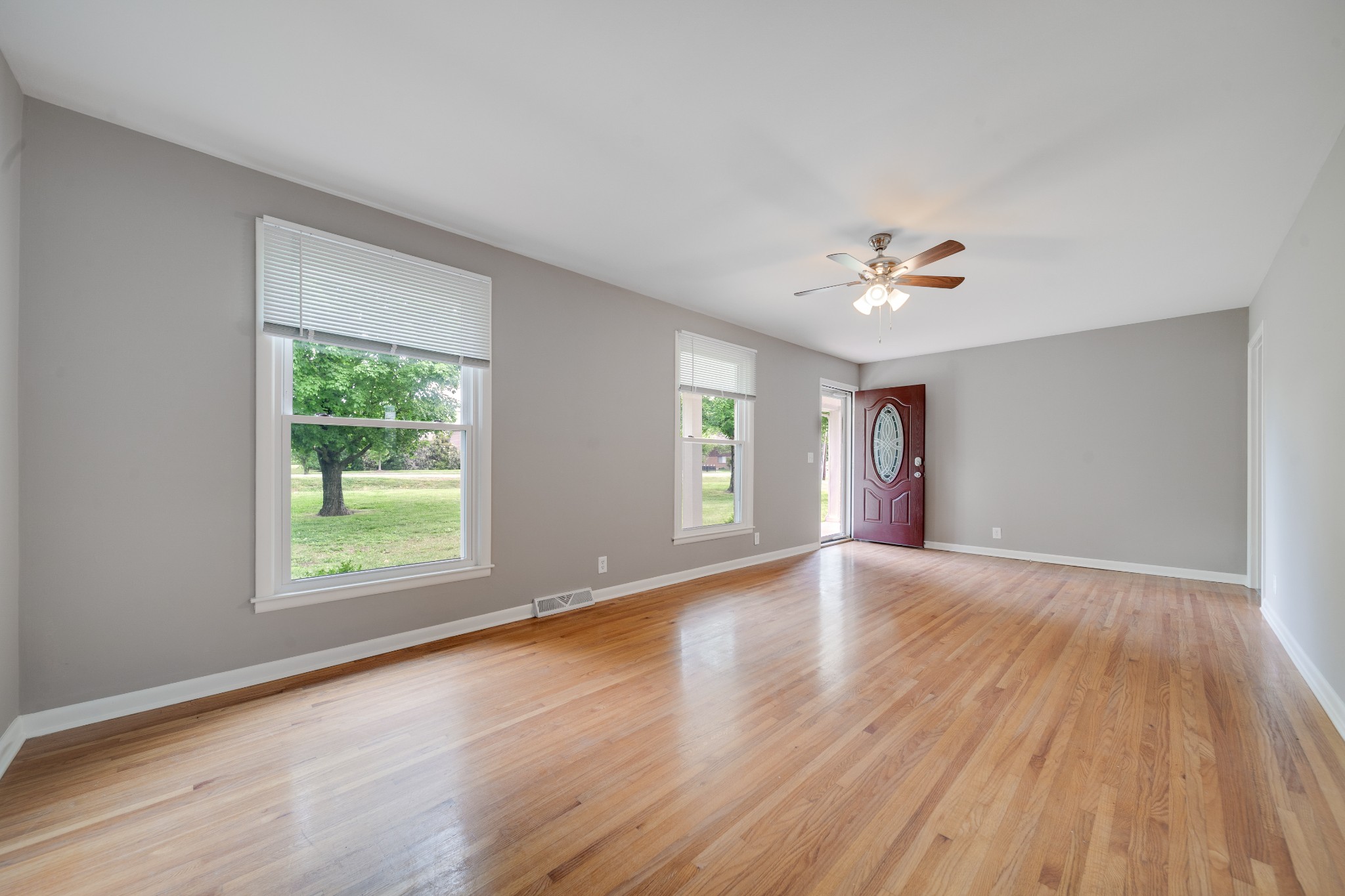 411 Walton Ferry Road Hendersonville, TN 37075 - Photo 12 of 26 a view of an empty room with a window and wooden floor