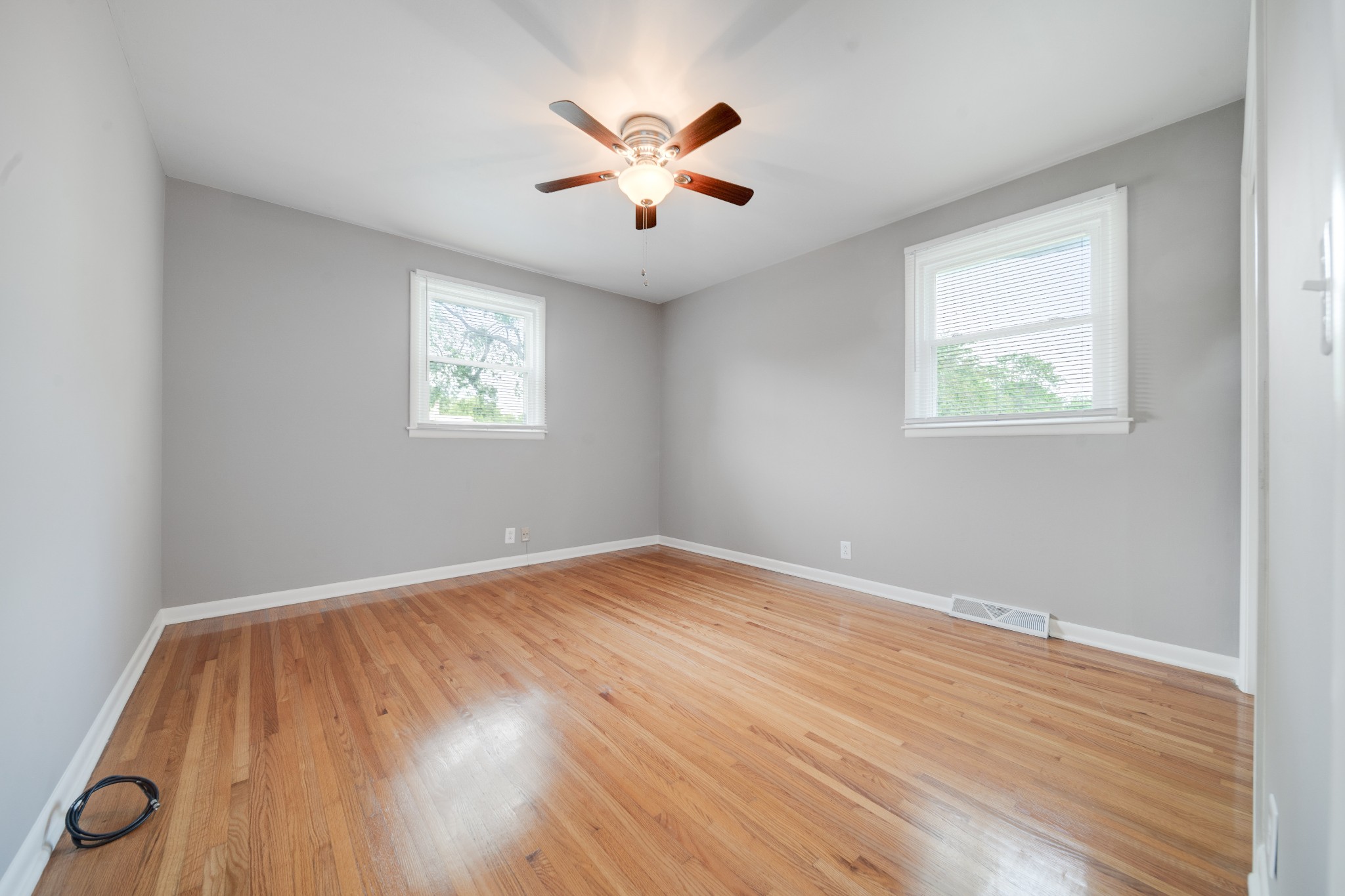 411 Walton Ferry Road Hendersonville, TN 37075 - Photo 15 of 26 an empty room with wooden floor and windows