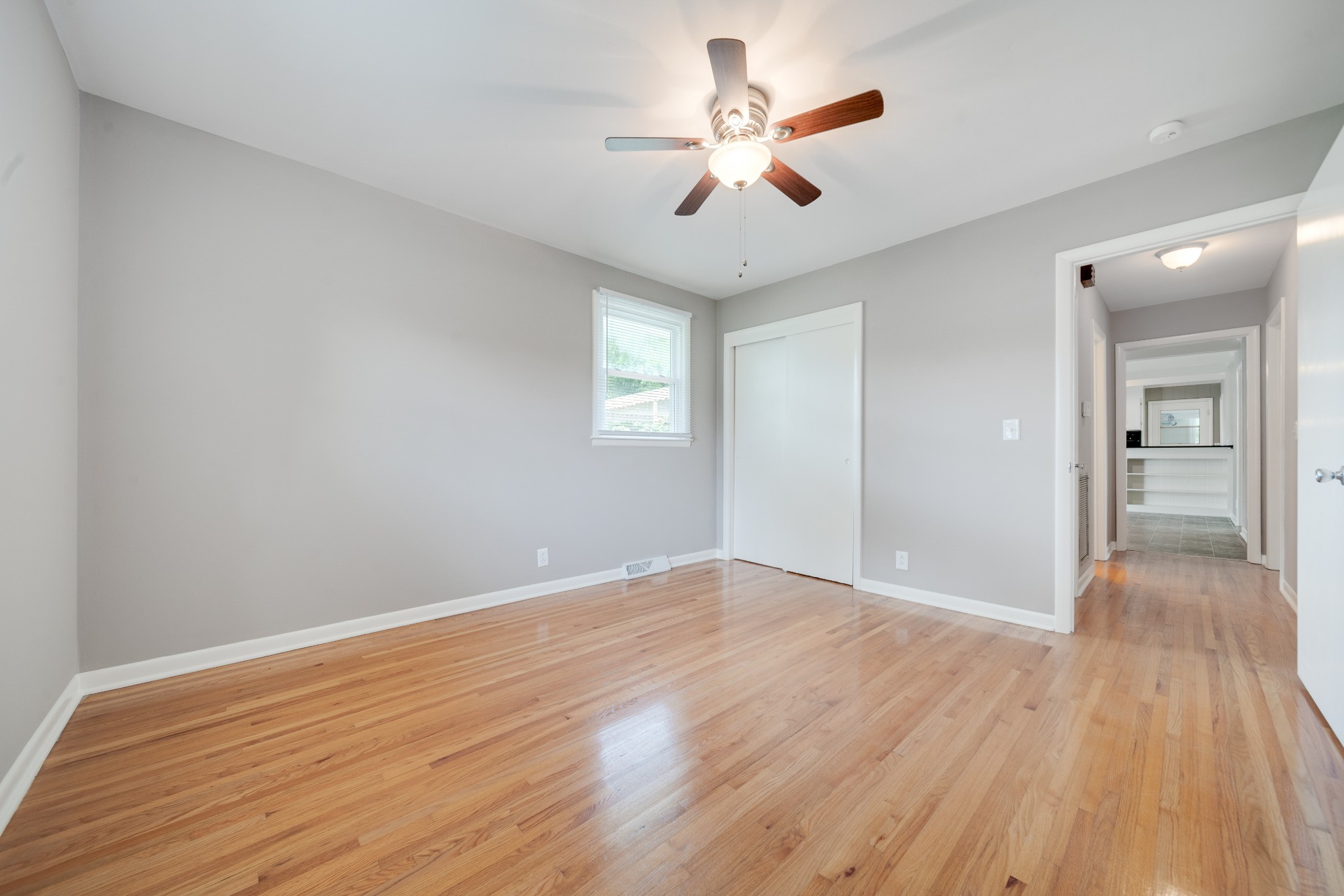 411 Walton Ferry Road Hendersonville, TN 37075 - Photo 16 of 26 wooden floor in an empty room with a window