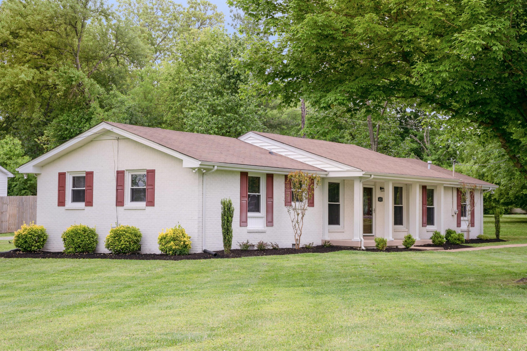 411 Walton Ferry Road Hendersonville, TN 37075 - Photo 2 of 26 a view of a house with backyard and garden