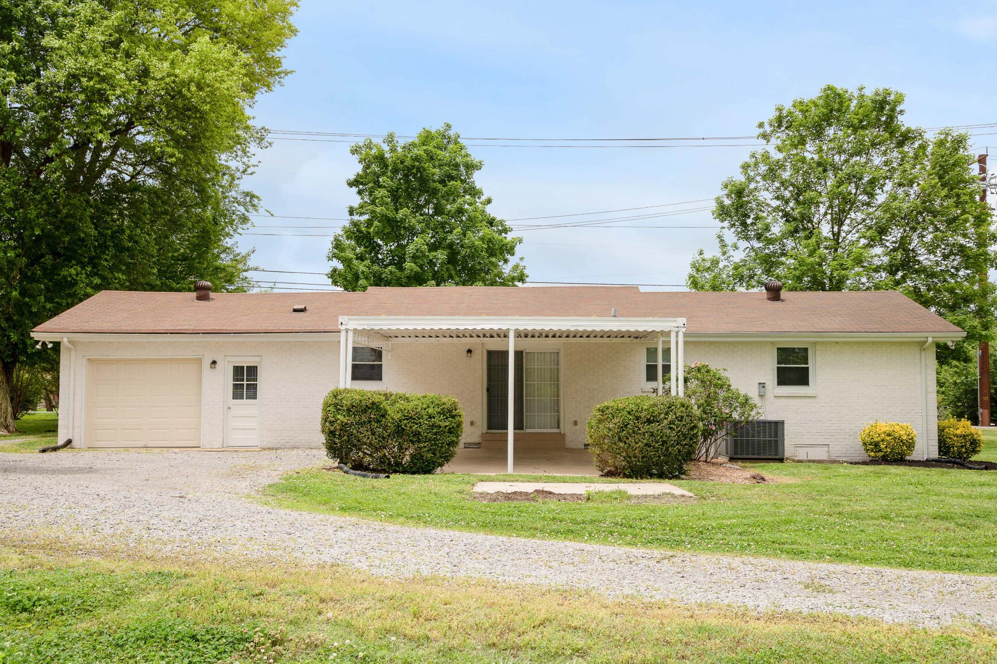 411 Walton Ferry Road Hendersonville, TN 37075 - Photo 26 of 26 a front view of a house with a garden