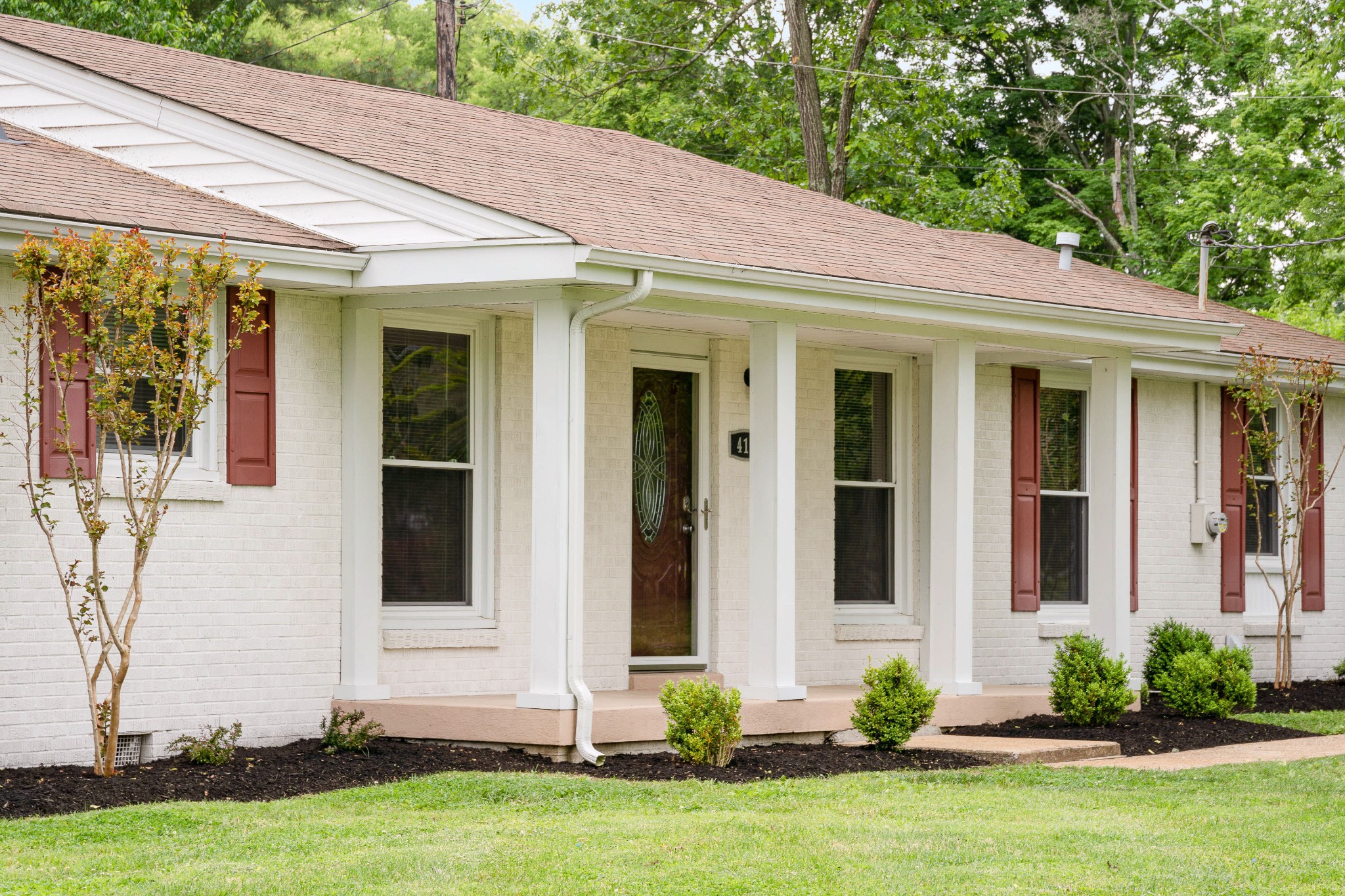 411 Walton Ferry Road Hendersonville, TN 37075 - Photo 3 of 26 a front view of a house with a yard and garage