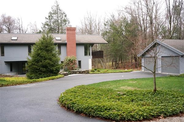 92 Slough Road Harvard, MA 01451 - Photo 1 of 30 a front view of a house with a yard and trees