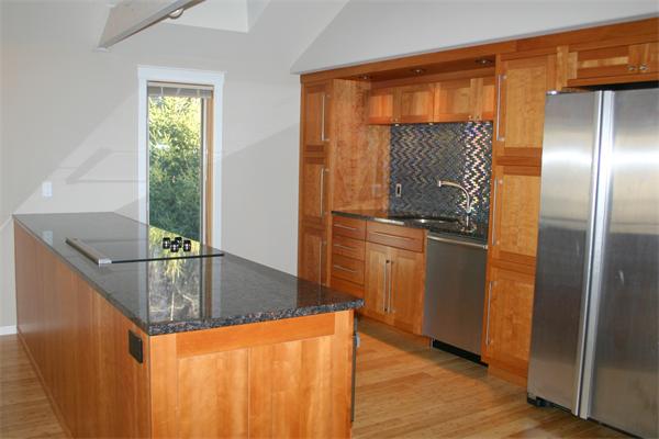92 Slough Road Harvard, MA 01451 - Photo 11 of 30 a kitchen with stainless steel appliances granite countertop a refrigerator a stove and a sink with wooden floor