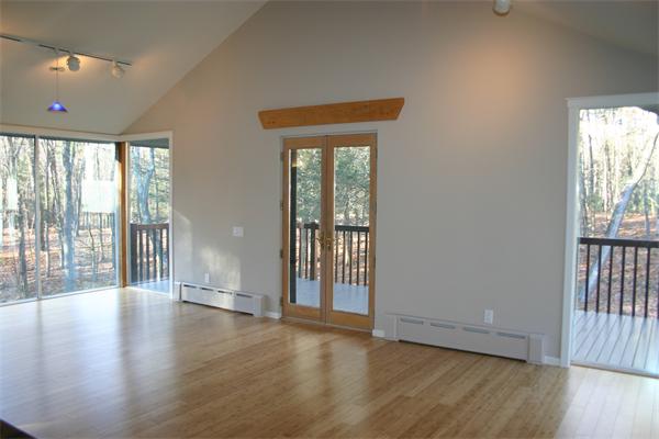 92 Slough Road Harvard, MA 01451 - Photo 14 of 30 an empty room with wooden floor and windows