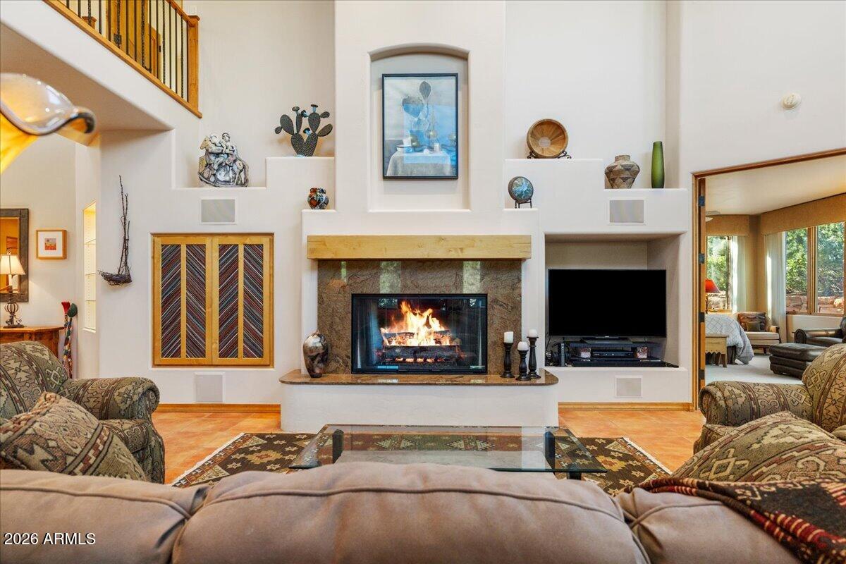 30 West Gunsmoke Road Sedona, AZ 86336 - Photo 12 of 73 a living room with furniture fireplace and flat screen tv