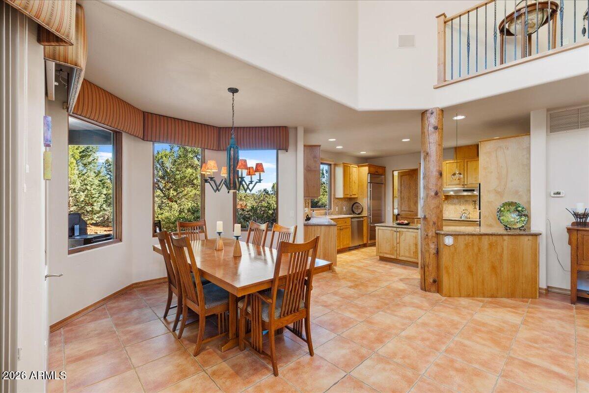 30 West Gunsmoke Road Sedona, AZ 86336 - Photo 15 of 73 a view of a dining room with furniture window and outside view