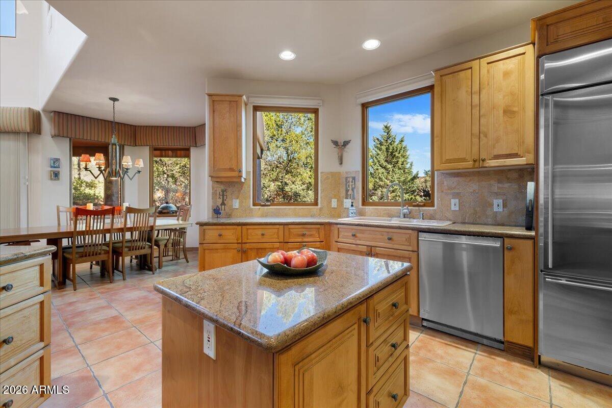 30 West Gunsmoke Road Sedona, AZ 86336 - Photo 18 of 73 a kitchen with stainless steel appliances granite countertop a sink and a refrigerator