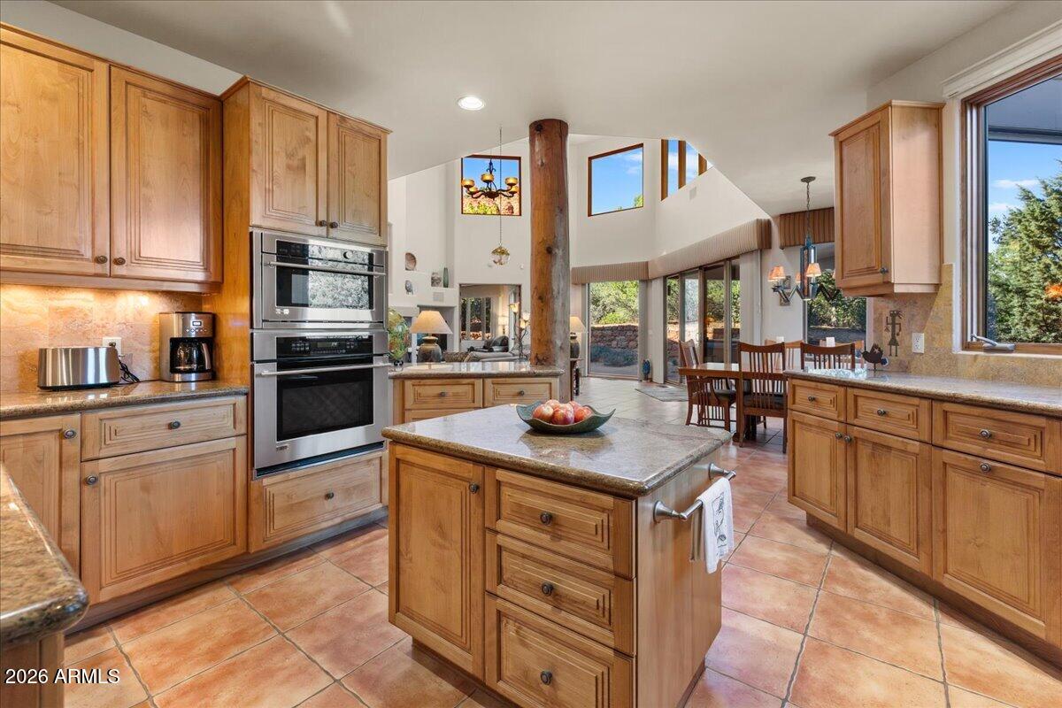 30 West Gunsmoke Road Sedona, AZ 86336 - Photo 20 of 73 a kitchen with stainless steel appliances granite countertop a sink and cabinets