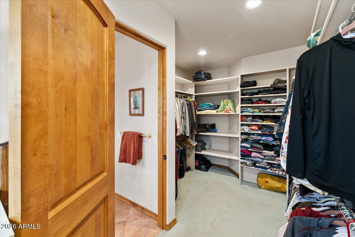 30 West Gunsmoke Road Sedona, AZ 86336 - Photo 28 of 73 a view of walk in closet with clothes and shoes