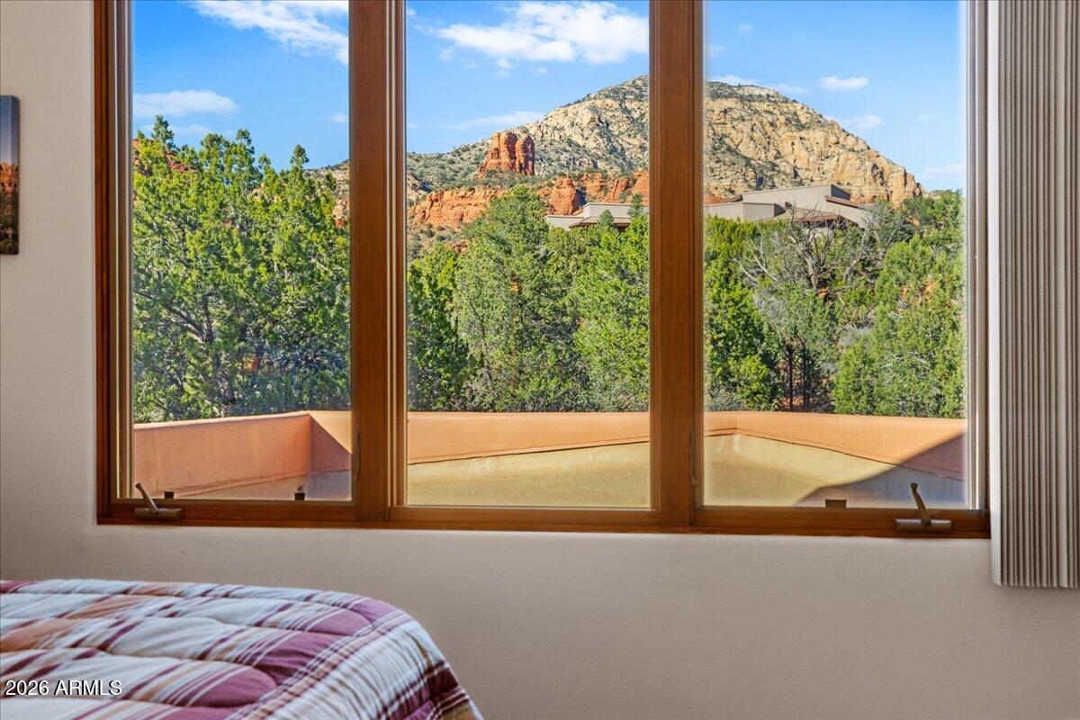 30 West Gunsmoke Road Sedona, AZ 86336 - Photo 46 of 73 a bed sitting in a bedroom next to a window