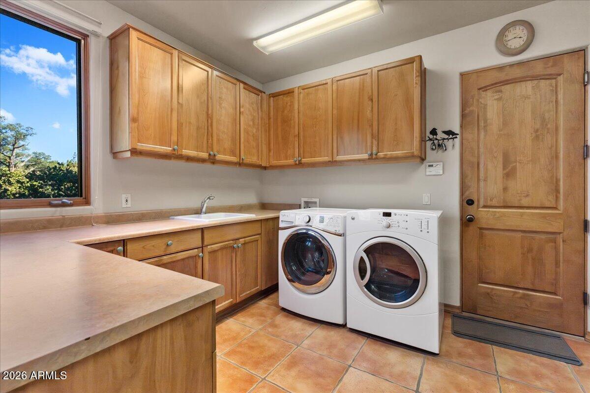 30 West Gunsmoke Road Sedona, AZ 86336 - Photo 48 of 73 a utility room with sink dryer and washer