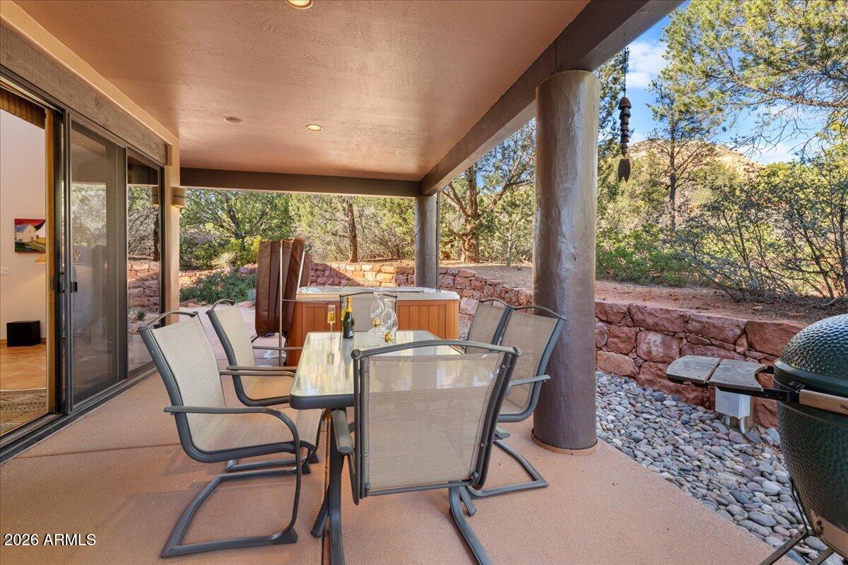 30 West Gunsmoke Road Sedona, AZ 86336 - Photo 54 of 73 a outdoor dining space with furniture and garden view
