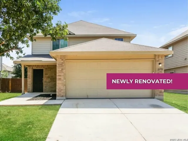 a sign that is sitting in front of a house