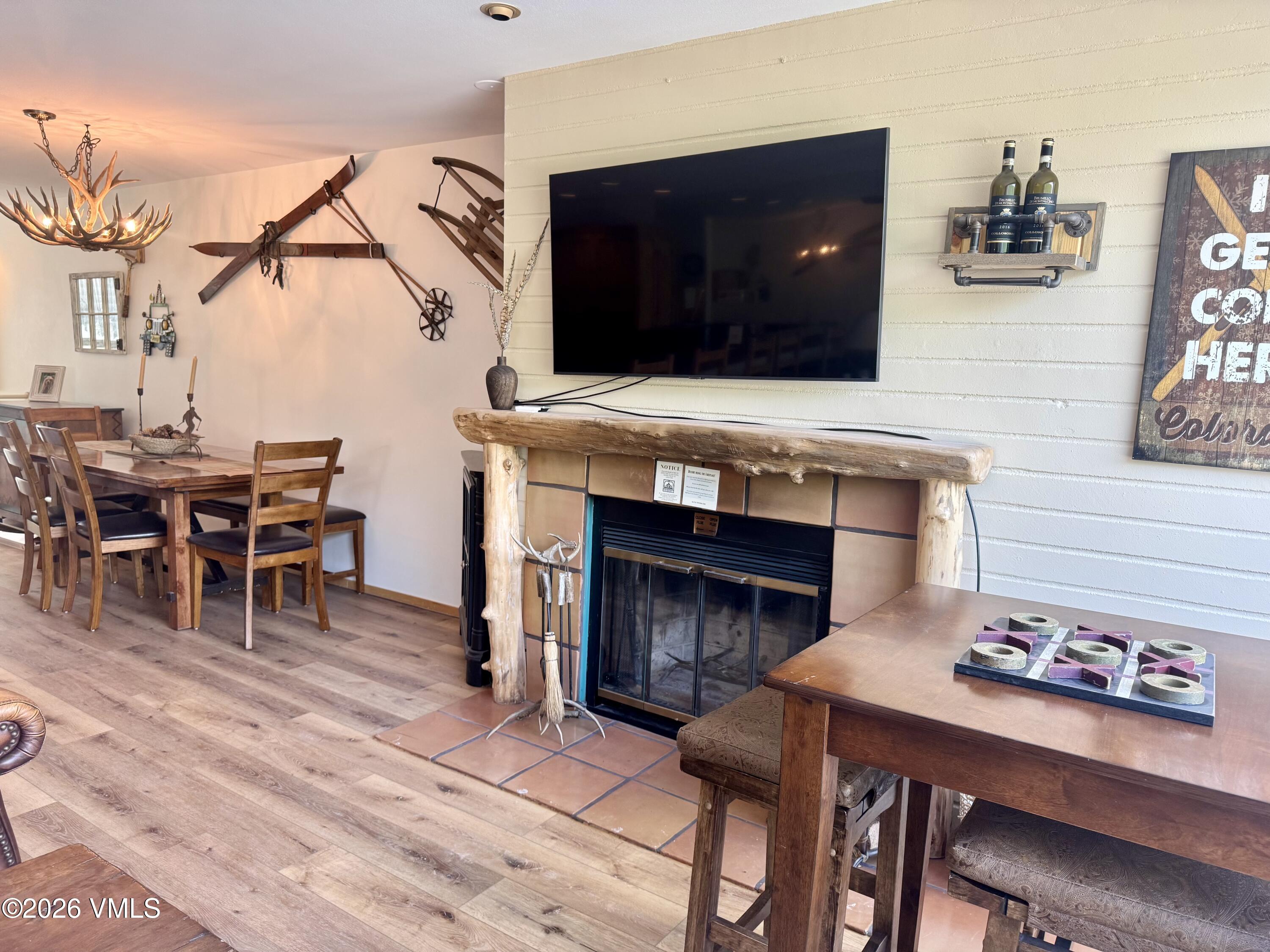 1100 North Frontage Road West, Unit 1519 Vail, CO 81657 - Photo 6 of 38 a living room with furniture and a fireplace