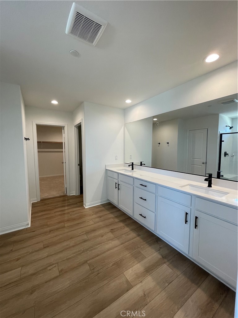 21518 Milam Drive Colton, CA 92324 - Photo 4 of 4 a large white kitchen with cabinets