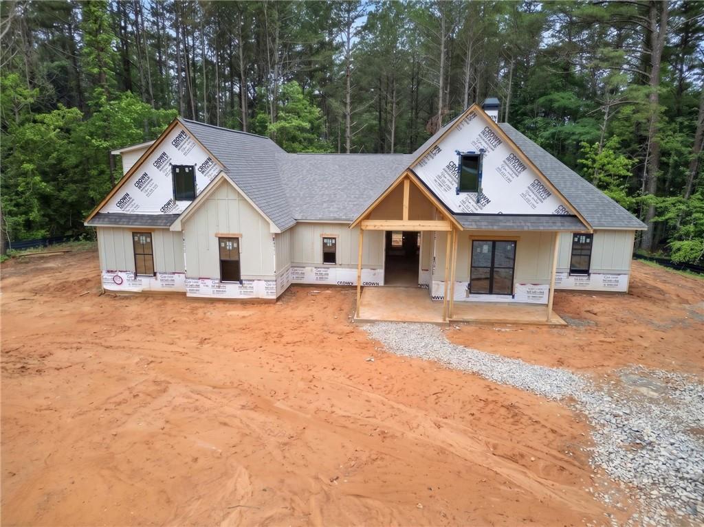 1698 Tibbitts Road Dallas, GA 30132 - Photo 3 of 16 a front view of a house with a yard and garage
