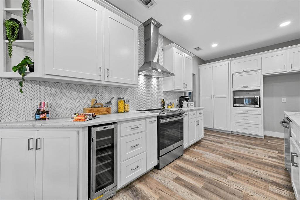 303 Riva Ridge Wylie, TX 75098 - Photo 13 of 38 a kitchen with granite countertop a sink stainless steel appliances and cabinets