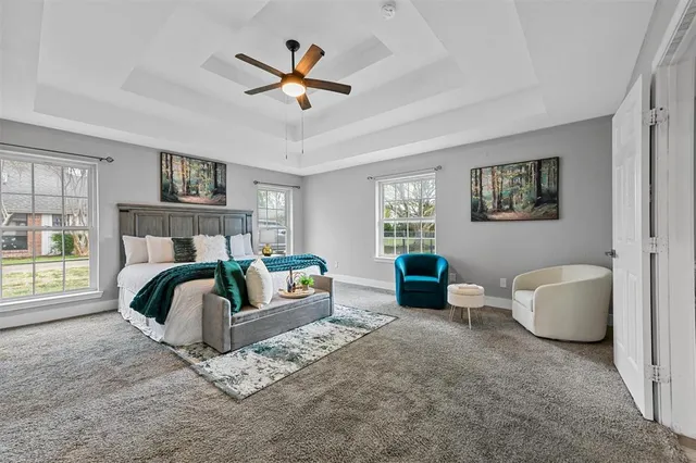 a bedroom with a bed and a couch