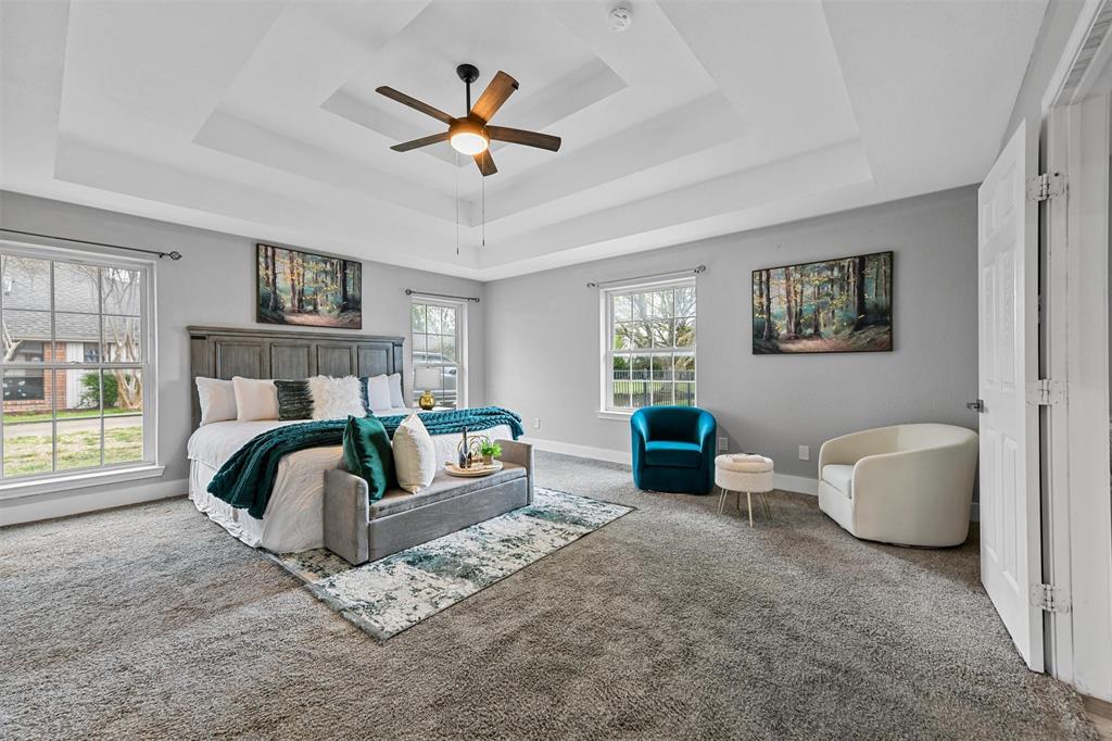 303 Riva Ridge Wylie, TX 75098 - Photo 19 of 38 a bedroom with a bed and a couch